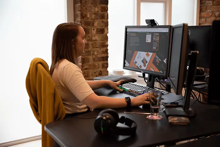 website design agency sitting desk