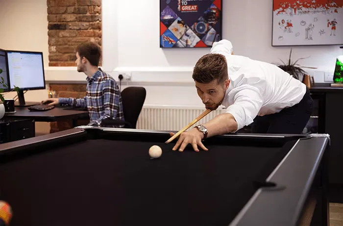 website design agency office playing pool