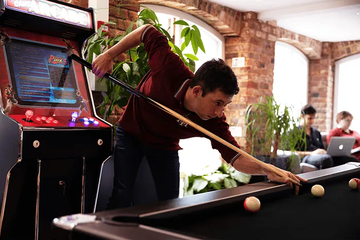 website design agency office playing pool